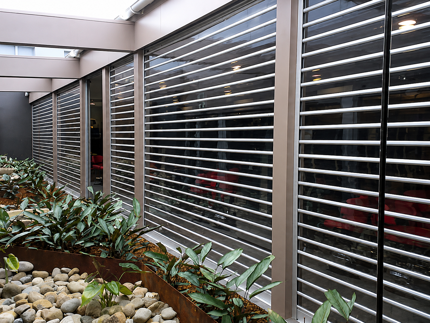 Polycarbonate shutter guide rail, bottom rail, and locking mechanism detail
